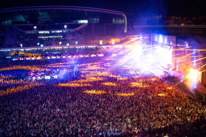 people-clapping-night-concert-partying-raising-hands-artist-stage-blurry-aerial-view-concert-crowd-happy-57884733